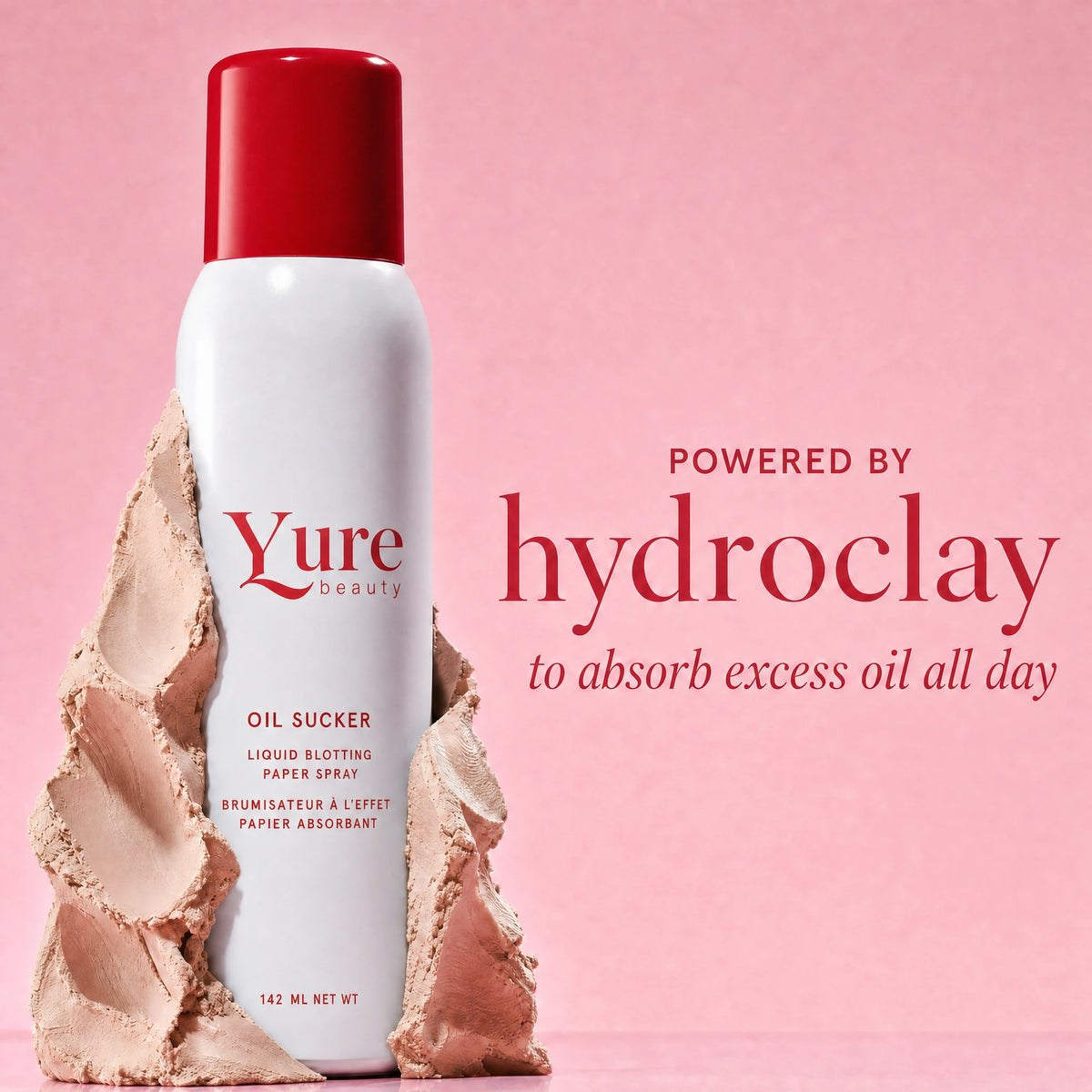 Glass Reset Mist bottle beside a textured clay form, illustrating the mineral clay complex that absorbs excess oil